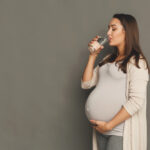 Pregnant woman drinking water