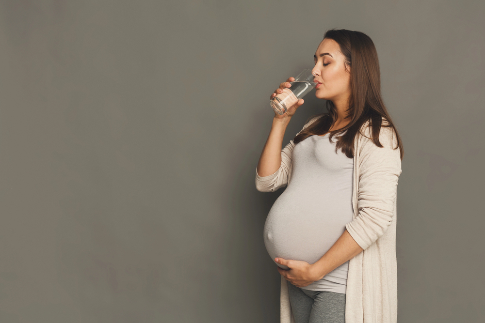 Pregnant woman drinking water