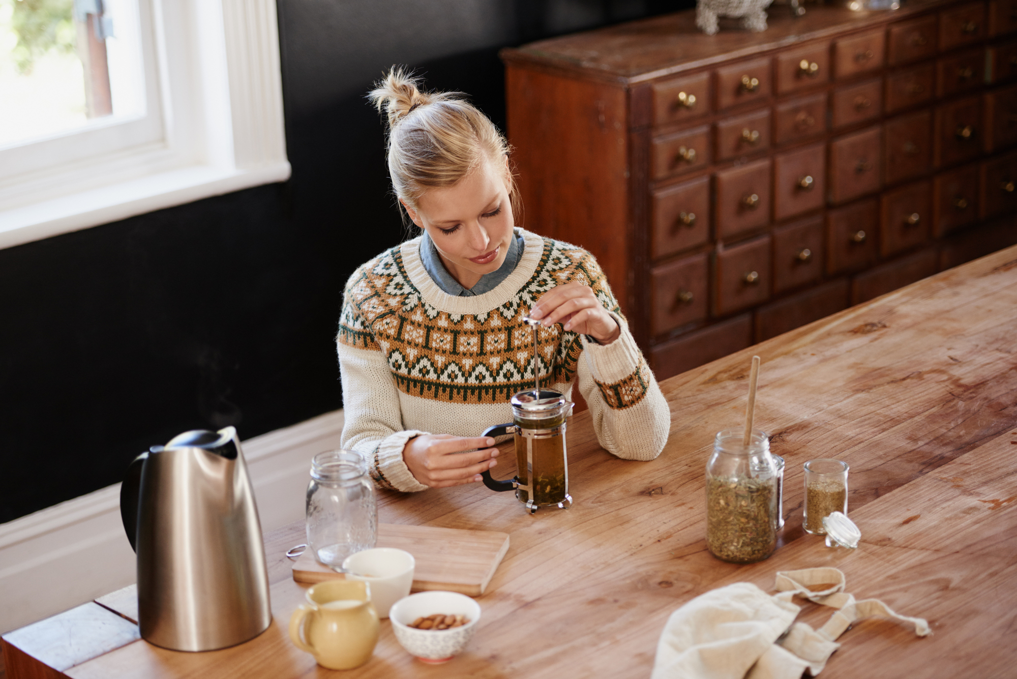 A woman having herbal tea.